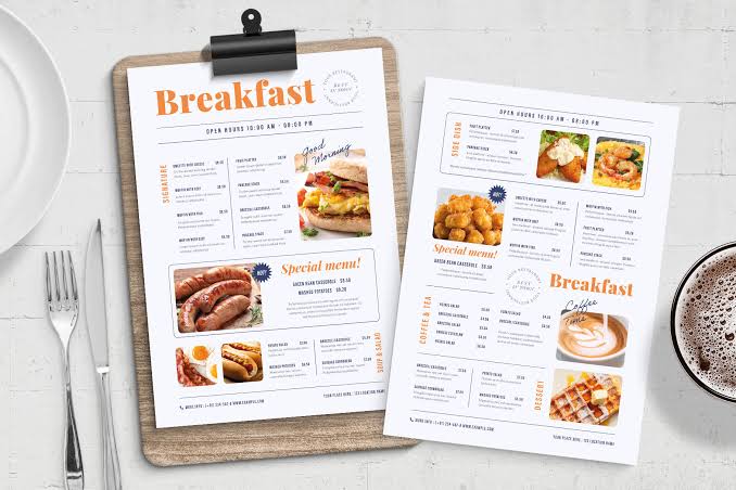 Printed single-sheet menu sample on a clipboard, with food photography