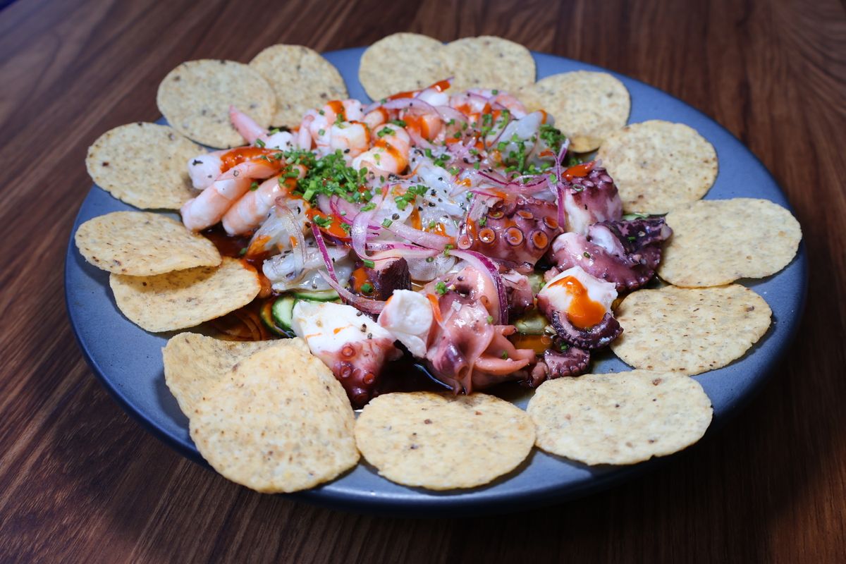 Fresh seafood ceviche platter with shrimp, octopus, and tortilla chips